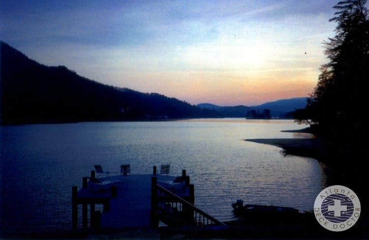Far Image Of Lake Dock At Dusk With Lake And Mountains In The Background. Circa 1998
