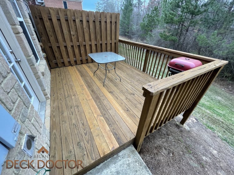 Image Of Deck In Doraville, Ga After Thorough Cleaning, Staining With TWP (gold).